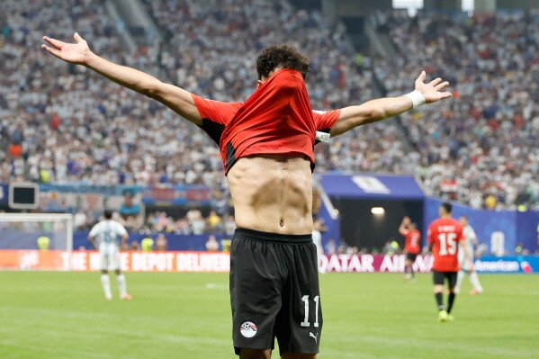 Egypt's Mostafa Zico (11) celebrates scoring their first goal during the World Cup round of 16 soccer match between Argentina and Egypt in Atlanta, Tuesday, July 7, 2026. (AP Photo/Erik S. Lesser)