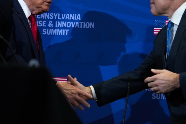 President Donald Trump shakes hands with Sen. Dave McCormick, R-Pa., as he arrives to speak during a roundtable at the Pennsylvania Defense and Innovation Summit, Wednesday, July 15, 2026, at the United States Army War College in Carlisle, Pa. (AP Photo/Julia Demaree Nikhinson)