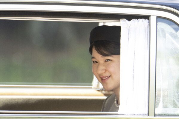 Japan's Princess Aiko leaves after visiting the tomb of the late Empress Nagako who died in 2000, at the Musashi Imperial Graveyard in Hachioji, west of Tokyo Thursday, April 25, 2024. (Yuichi Yamazaki/Pool Photo via AP)
