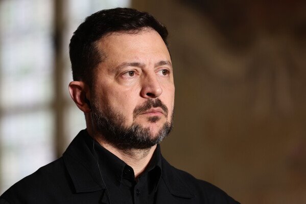 Ukrainian President Volodymyr Zelensky addresses a press conference after the Coalition of the Willing summit on security guarantees for Ukraine in Paris, Monday, July 13, 2026. (Teresa Suarez/Pool Photo via AP)