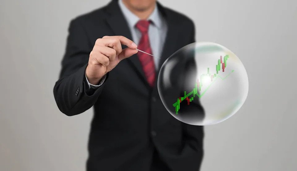 Businessman in suit pricking a stock market bubble with rising candlestick chart inside