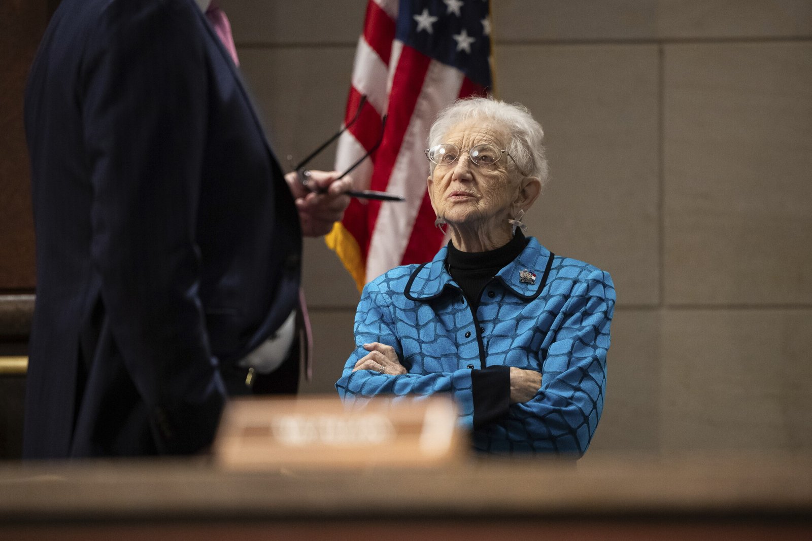 Rep. Virginia Foxx confers with an aide.