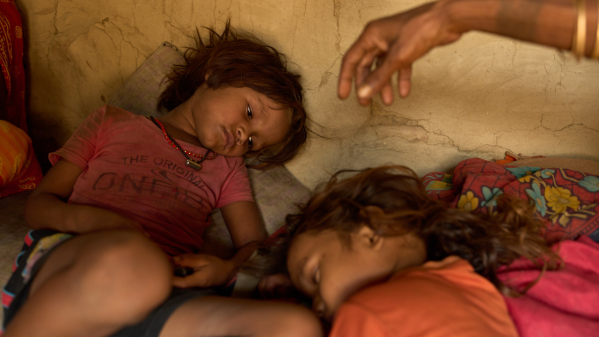 A photo of Kabita Mukhiya, who died during pregnancy, is displayed on a phone on May 19, 2026, in Gaur, Nepal. (AP Photo/Bram Janssen)