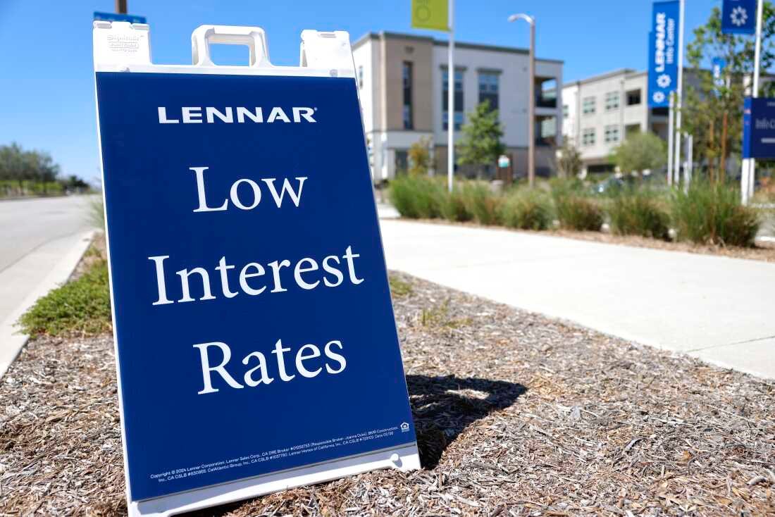 An A-frame sign says 