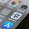 The ChatGPT app icon is seen on a smartphone screen, among other app icons.