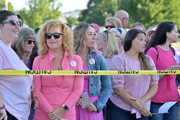 Supporters of Lindsay Clancy stand outside Plymouth Superior Court where Clancy is on trial for the death of her three children, Thursday, Aug. 20, 2026., in Plymouth, Mass.   (AP Photo/Josh Reynolds )
