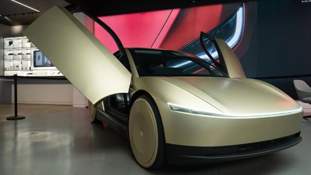 Bellevue, WA, USA - Dec 5, 2024: The Cybercab, a two-passenger battery-electric self-driving car under development by Tesla, is seen on display at a Tesla showroom in Bellevue, Washington.