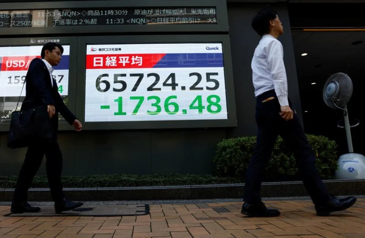 asia-stocks-waver-as-yen-surges,-iran-warns-of-retaliation