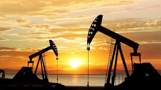 oil drilling sunset