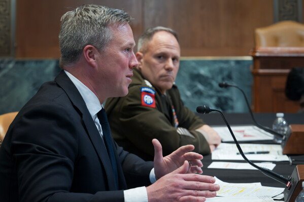 Secretary of the Army Dan Driscoll, left, and Gen. Christopher LaNeve, vice chief of staff of the Army, appear before the Senate Defense Appropriations Subcommittee as the panel hears President Donald Trump's funding requests for the Army, at the Capitol in Washington, May 19, 2026.  (AP Photo/J. Scott Applewhite, File)