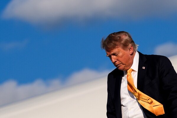 President Donald Trump disembarks Air Force One at Morristown Airport, Friday, Sept. 4, 2026, in Morristown, N.J. (AP Photo/Julia Demaree Nikhinson)