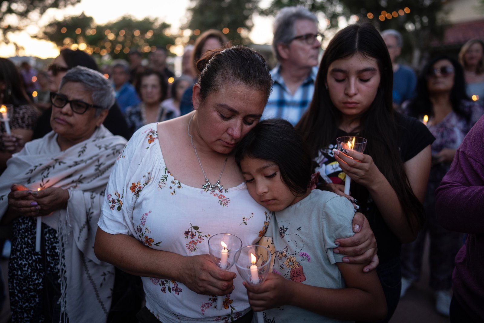 Judith Cabrera and her daughter, April, attend a vigil for the victims of a fatal SUV-Metro bus collision and the subsequent crash of a TV news helicopter covering it in the Chatsworth neighborhood of Los Angeles, Thursday, Sept. 17, 2026. (AP Photo/Jae C. Hong)