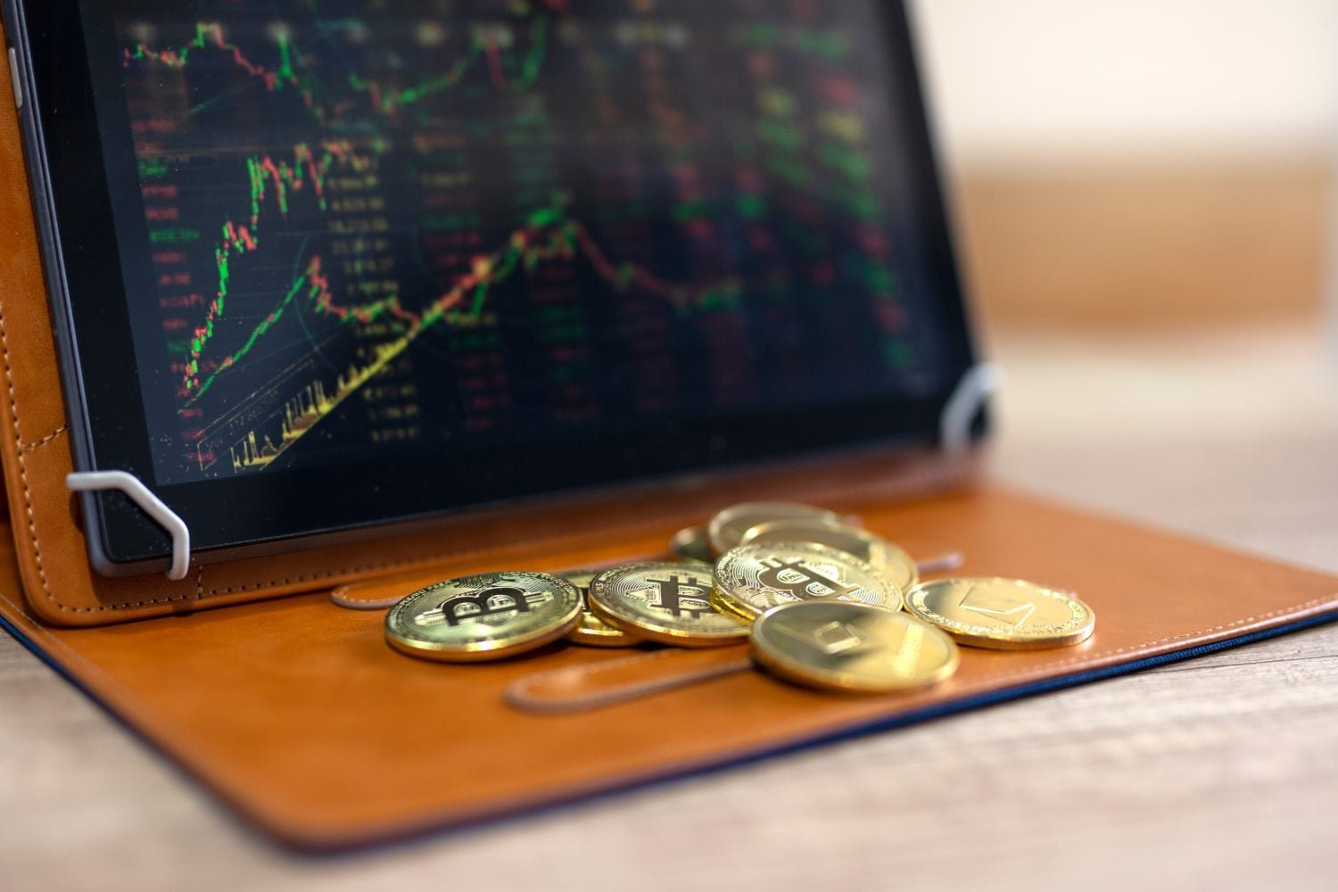 Crypto currency bitcoin and ethereum market on tablet with stock graph